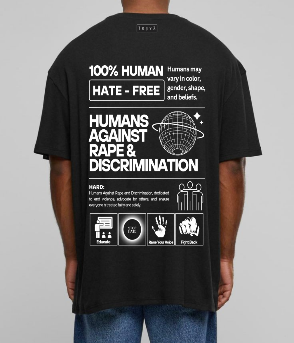 A person wearing an oversized black t-shirt with white text and graphics promoting human rights.